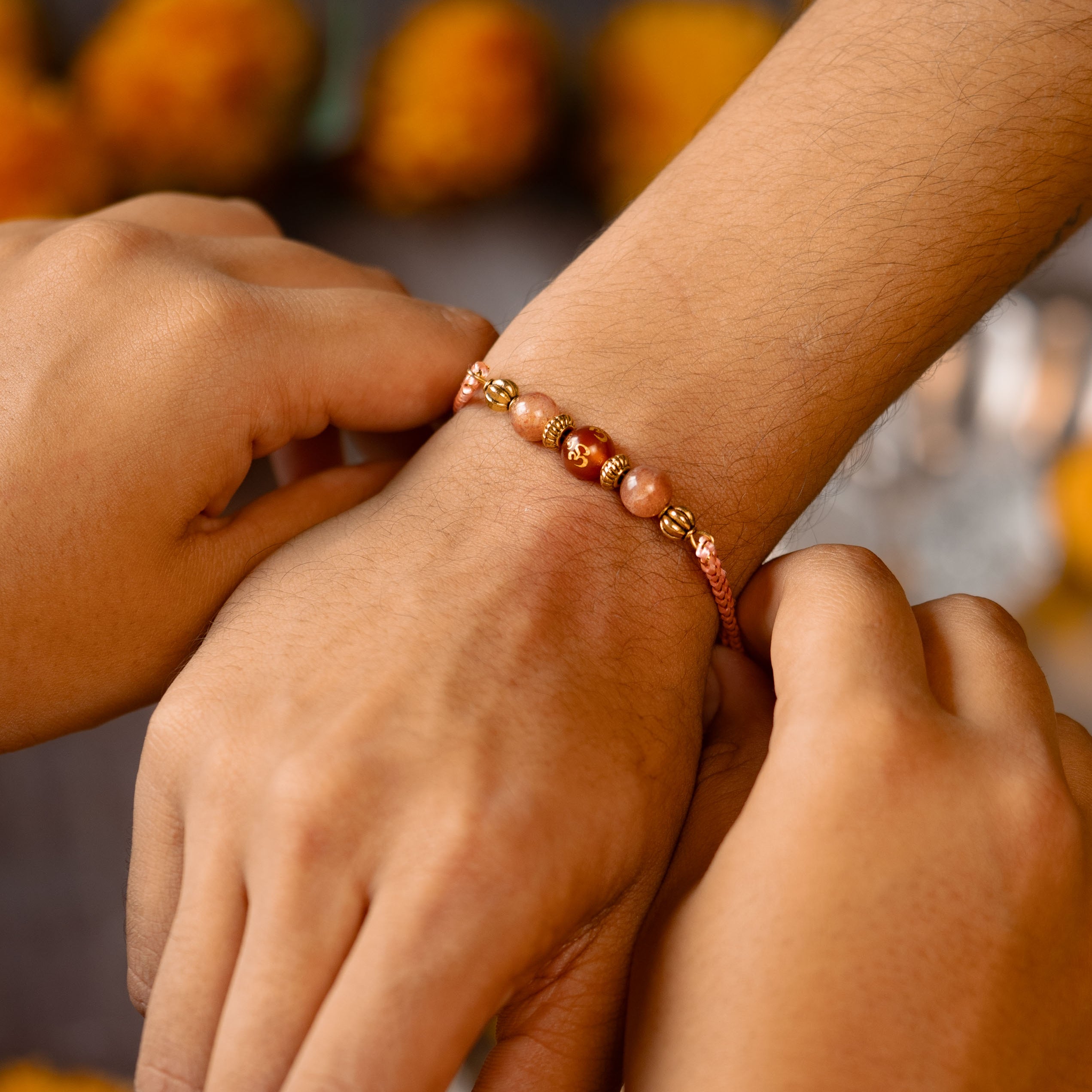 Positivity Sunstone Red Om Natural Stone Rakhi